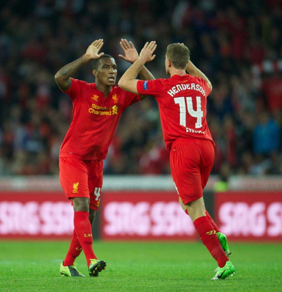 Andre Wisdom congratulated by Jordan Henderson after scoring on his first team debut against Young Boys (Pic: David Rawcliffe)