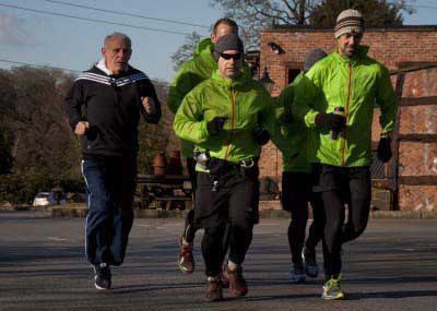 Peter Reid, sets off with runners part of their 96 mile run between Hillsborough and Anfield