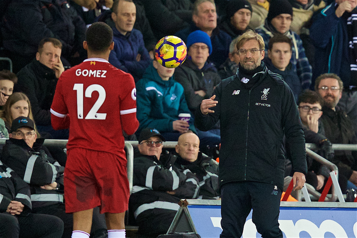 SWANSEA, WALES - Monday, January 22, 2018: Liverpool's manager Jürgen Klopp throws the ball to Joe Gomez during the FA Premier League match between Swansea City FC and Liverpool FC at the Liberty Stadium. (Pic by David Rawcliffe/Propaganda)