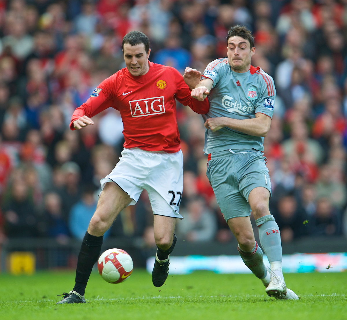 MANCHESTER, ENGLAND - Saturday, March 14, 2009: Liverpool's Albert Riera and Manchester United's John O'Shea during the Premiership match at Old Trafford. (Photo by David Rawcliffe/Propaganda)