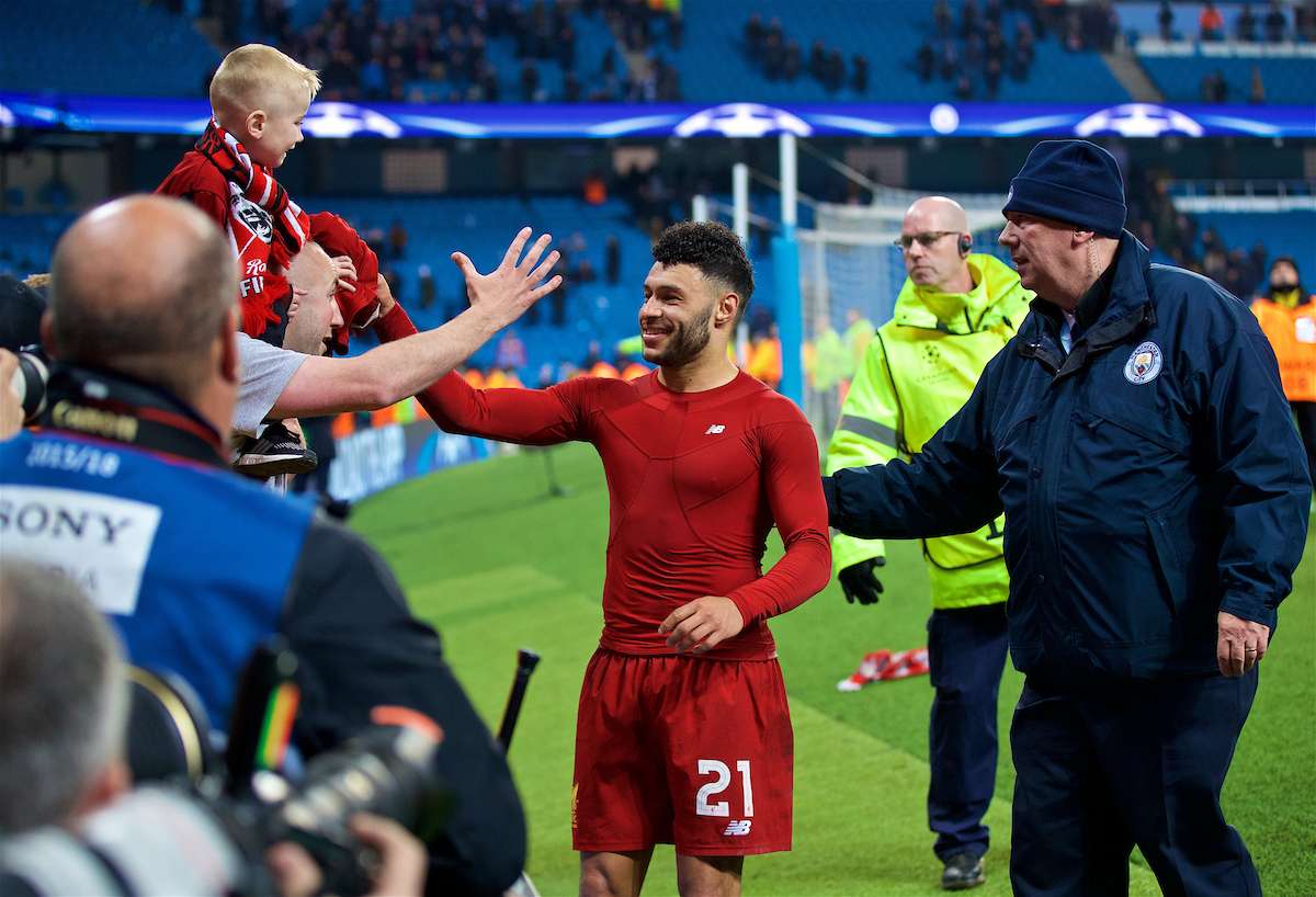 MANCHESTER, ENGLAND - Tuesday, April 10, 2018: Liverpool's Alex Oxlade-Chamberlain hands his shirt to a young supporter after the 2-1 (5-1 aggregate) victory over Manchester City during the UEFA Champions League Quarter-Final 2nd Leg match between Manchester City FC and Liverpool FC at the City of Manchester Stadium. (Pic by David Rawcliffe/Propaganda)