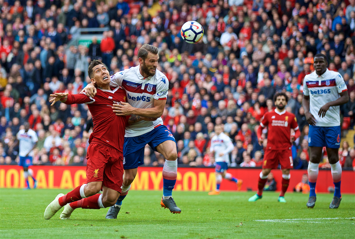LIVERPOOL, ENGLAND - Saturday, April 28, 2018: Liverpool's Roberto Firmino is brought down by Stoke City's Erik Pieters but no penalty is awarded during the FA Premier League match between Liverpool FC and Stoke City FC at Anfield. (Pic by David Rawcliffe/Propaganda)