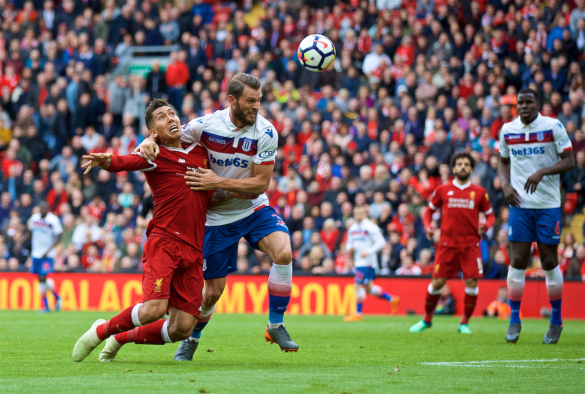 LIVERPOOL, ENGLAND - Saturday, April 28, 2018: Liverpool's Roberto Firmino is brought down by Stoke City's Erik Pieters but no penalty is awarded during the FA Premier League match between Liverpool FC and Stoke City FC at Anfield. (Pic by David Rawcliffe/Propaganda)