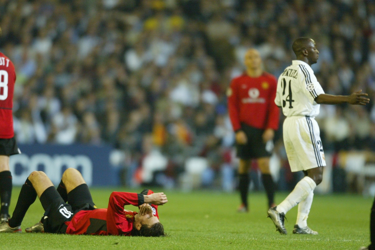 MADRID, SPAIN - Tuesday, April 8, 2003: Manchester United's Ruud Van Nistelrooy lies on the floor after pretending to be elbowed by Real Madrid's Claude Makelele during the UEFA Champions League Quarter Final 1st Leg match at the Estadio Santiago Bernabeu. (Pic by David Rawcliffe/Propaganda)