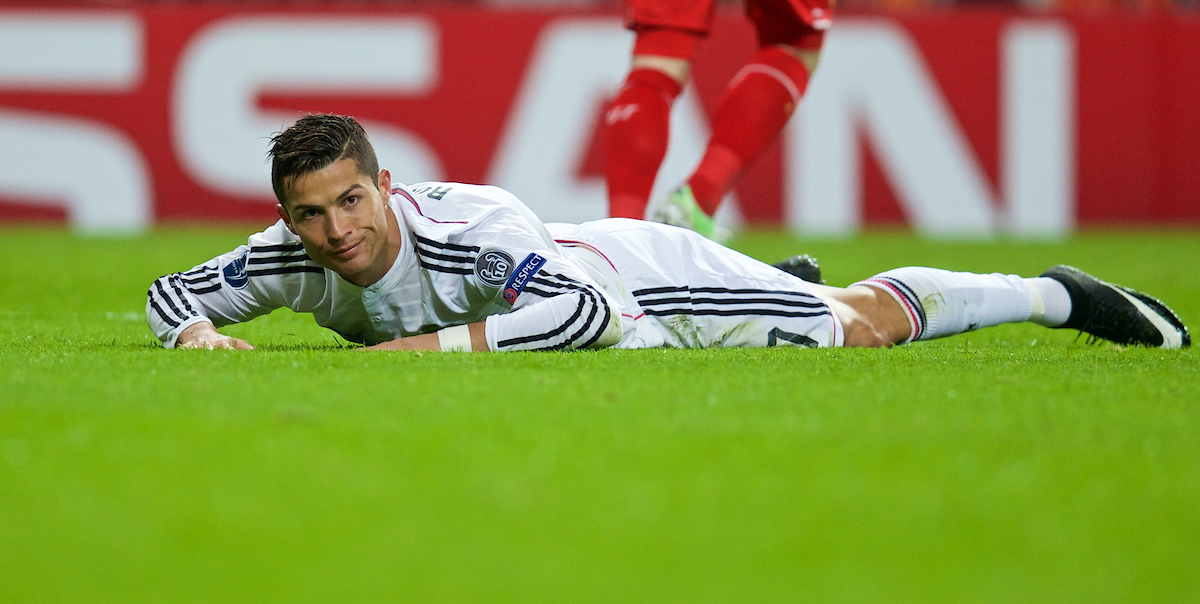 MADRID, SPAIN - Tuesday, November 4, 2014: Real Madrid's Cristiano Ronaldo looks dejected after being bundled off the ball during the UEFA Champions League Group B match against Liverpool at the Estadio Santiago Bernabeu. (Pic by David Rawcliffe/Propaganda)