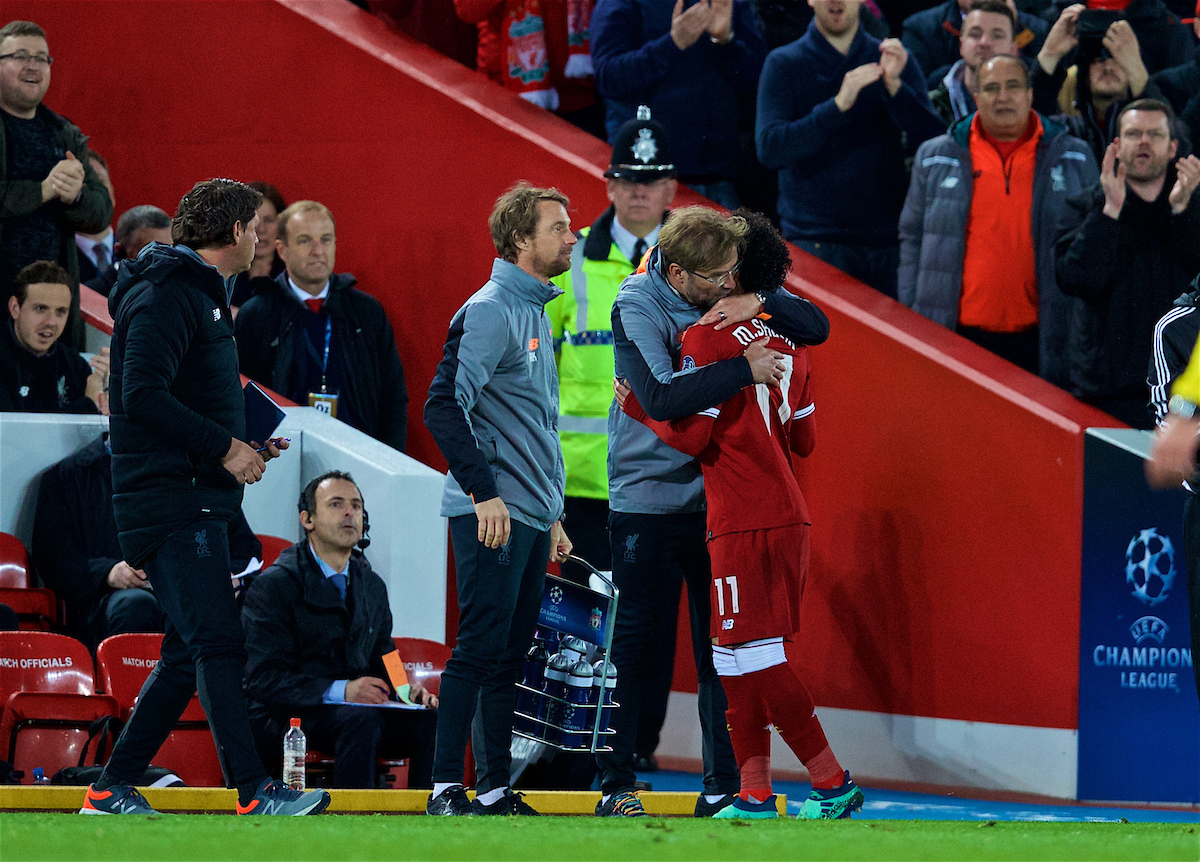 LIVERPOOL, ENGLAND - Tuesday, April 24, 2018: Liverpool's Mohamed Salah is embraced by manager Jürgen Klopp as he is substituted during the UEFA Champions League Semi-Final 1st Leg match between Liverpool FC and AS Roma at Anfield. (Pic by David Rawcliffe/Propaganda)