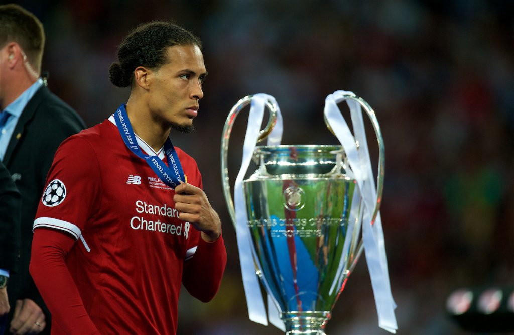 KIEV, UKRAINE - Saturday, May 26, 2018: Liverpool's Virgil van Dijk walks past the trophy dejected with his runners-up medal during the UEFA Champions League Final match between Real Madrid CF and Liverpool FC at the NSC Olimpiyskiy. Real Madrid won 3-1. (Pic by Peter Powell/Propaganda)