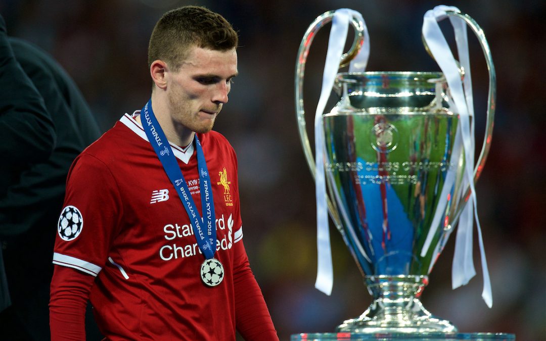 Liverpool's Andy Robertson walks past the trophy with his runner's-up medal after the UEFA Champions League Final match between Real Madrid CF and Liverpool FC at the NSC Olimpiyskiy. Real Madrid won 3-1.