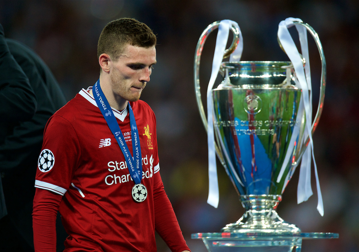 KIEV, UKRAINE - Saturday, May 26, 2018: Liverpool's Andy Robertson walks past the trophy with his runner's-up medal after the UEFA Champions League Final match between Real Madrid CF and Liverpool FC at the NSC Olimpiyskiy. Real Madrid won 3-1. (Pic by Peter Powell/Propaganda)