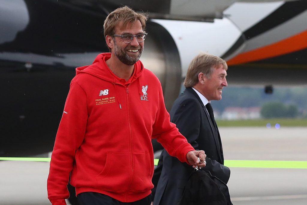 BASEL, SWITZERLAND - MAY 16: Liverpool's manager J¸rgen Klopp and non-executive director Kenny Dalglish arrive at Basel airport ahead of the UEFA Europa League Final against Sevilla. (Photo by UEFA/Pool)