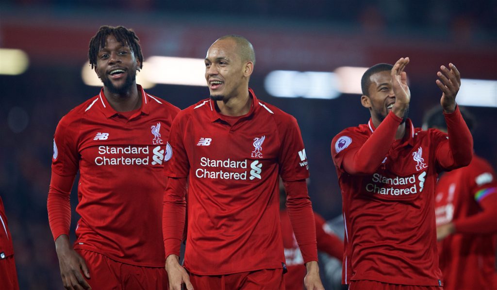 LIVERPOOL, ENGLAND - Sunday, December 2, 2018: Liverpool's match winning goal-scorer Divock Origi (L) celebrates with Fabio Henrique Tavares 'Fabinho' and Georginio Wijnaldum after a dramatic late injury time goal during the FA Premier League match between Liverpool FC and Everton FC at Anfield, the 232nd Merseyside Derby. Liverpool won 1-0. (Pic by Paul Greenwood/Propaganda)