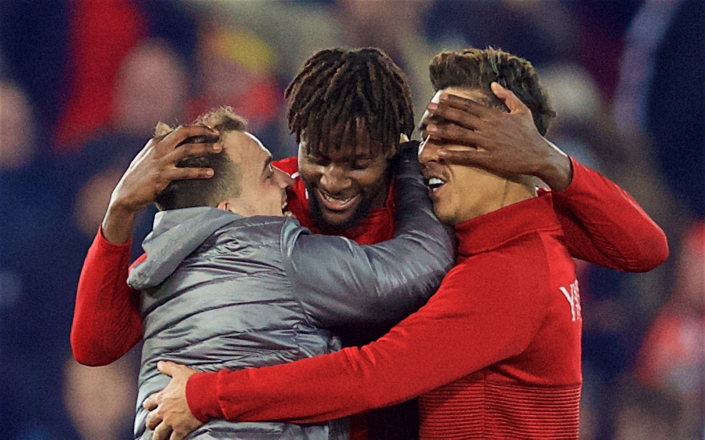LIVERPOOL, ENGLAND - Sunday, December 2, 2018: Liverpool's match winning goal-scorer Divock Origi (C) celebrates with Xherdan Shaqiri (L) and Roberto Firmino (R) after a dramatic late injury time goal during the FA Premier League match between Liverpool FC and Everton FC at Anfield, the 232nd Merseyside Derby. Liverpool won 1-0. (Pic by Paul Greenwood/Propaganda)
