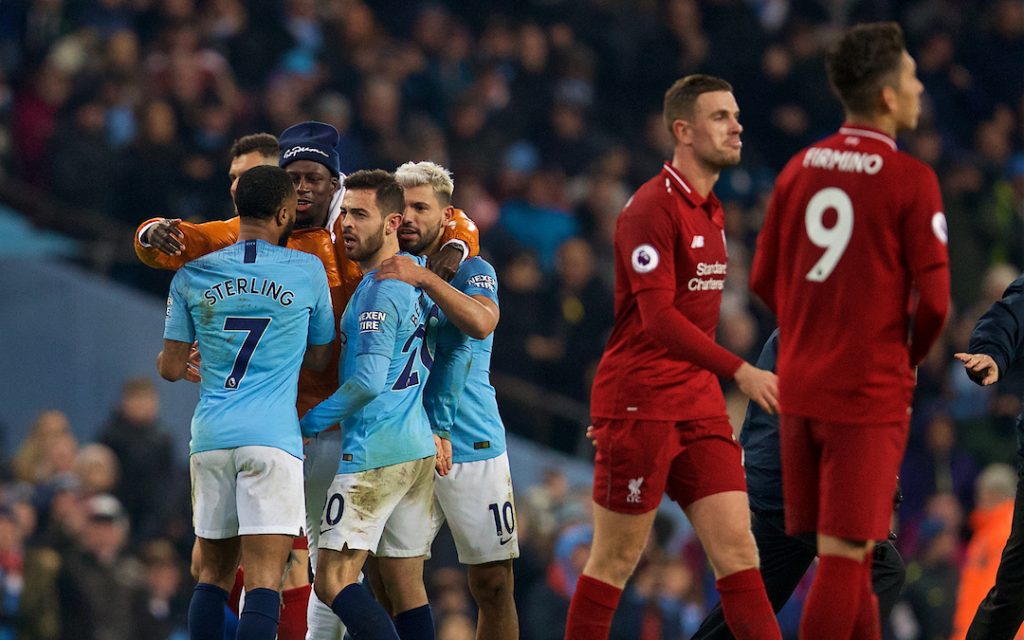 MANCHESTER, ENGLAND - Thursday, January 3, 2019: Manchester City's Manchester City's Benjamin Mendy (orange coat) celebrates the 2-1 victory over Liverpool at the final whistle with team-mates Raheem Sterling and Bernardo Silva after the FA Premier League match between Manchester City FC and Liverpool FC at the Etihad Stadium. (Pic by David Rawcliffe/Propaganda)