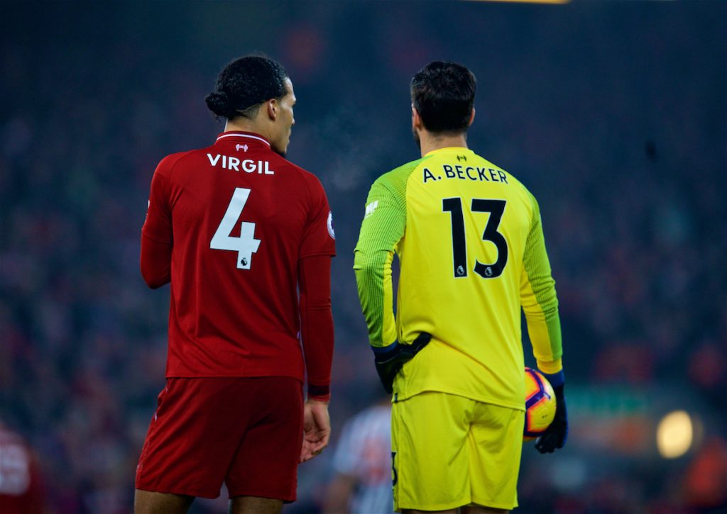 LIVERPOOL, ENGLAND - Boxing Day, Wednesday, December 26, 2018: Liverpool's Virgil van Dijk (L) and goalkeeper Alisson Becker during the FA Premier League match between Liverpool FC and Newcastle United FC at Anfield. (Pic by David Rawcliffe/Propaganda)