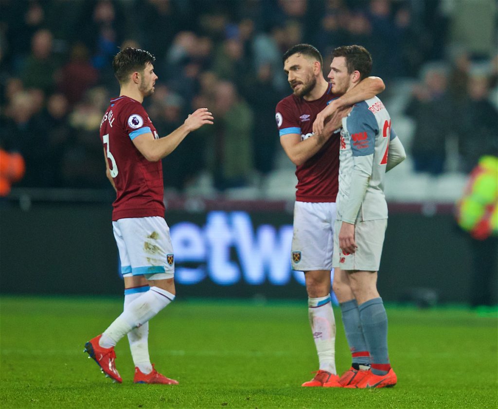 LONDON, ENGLAND - Monday, February 4, 2019: Liverpool's Andy Robertson with West Ham United's Robert Snodgrass and Aaron Cresswell at the final whistle during the FA Premier League match between West Ham United FC and Liverpool FC at the London Stadium. (Pic by David Rawcliffe/Propaganda)