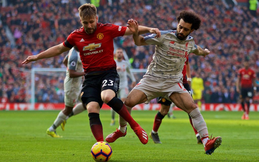 MANCHESTER, ENGLAND - Sunday, February 24, 2019: Manchester United's Luke Shaw (L) and Liverpool's Mohamed Salah during the FA Premier League match between Manchester United FC and Liverpool FC at Old Trafford. (Pic by David Rawcliffe/Propaganda)