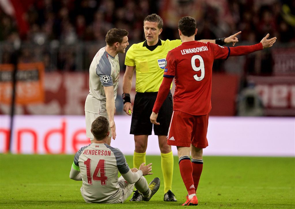 MUNICH, GERMANY - Wednesday, March 13, 2019: Liverpool's captain Jordan Henderson goes down injured as the referee Daniele Orsato orders him off the field during the UEFA Champions League Round of 16 2nd Leg match between FC Bayern München and Liverpool FC at the Allianz Arena. (Pic by David Rawcliffe/Propaganda)