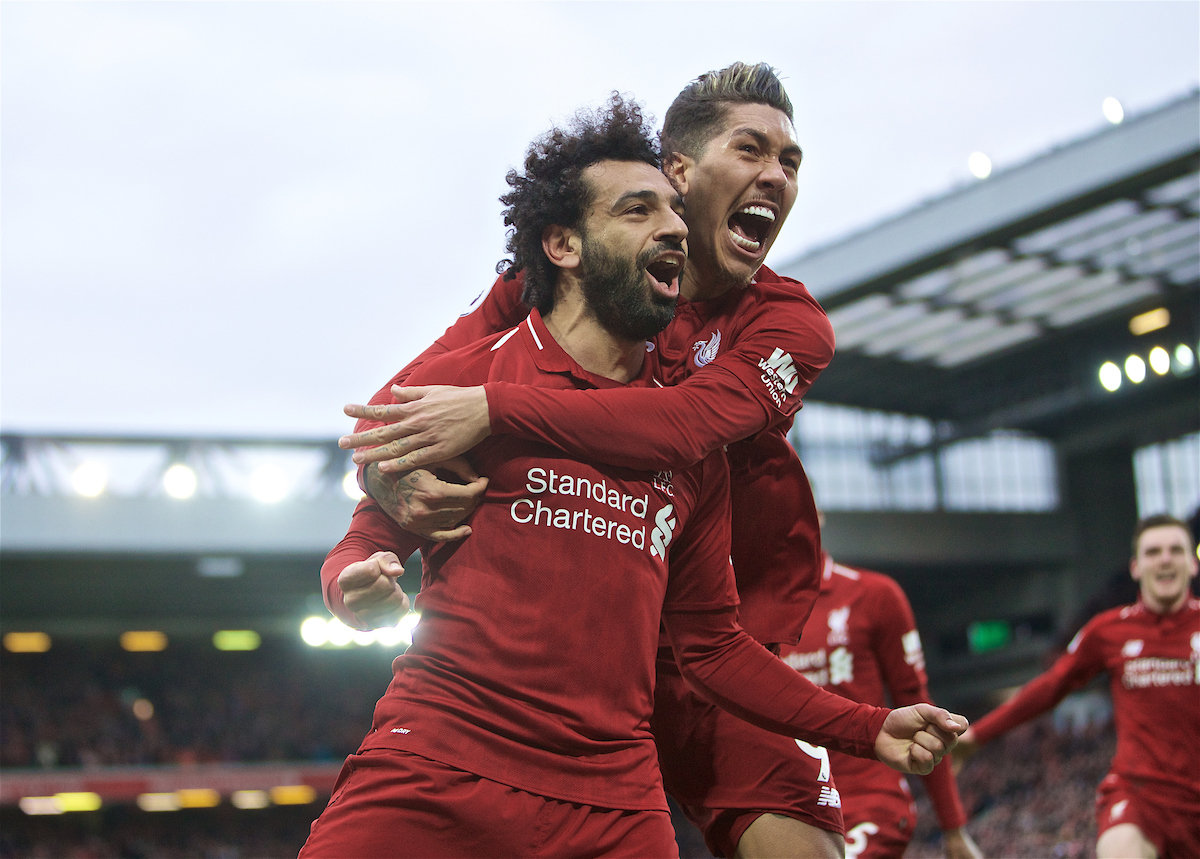 LIVERPOOL, ENGLAND - Sunday, March 31, 2019: Liverpool's Mohamed Salah celebrates after his header forced a winning goal, an own goal from Tottenham Hotspur's Toby Alderweireld with team mate Roberto Firmino during the FA Premier League match between Liverpool FC and Tottenham Hotspur FC at Anfield. (Pic by David Rawcliffe/Propaganda)