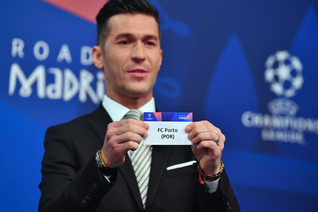 NYON, SWITZERLAND - Monday, December 17, 2018: Former Liverpool player and Champions League winner Luis Garcia holds up FC Porto after making the draw during the UEFA Champions League 2018/19 Round of 16 draw at the UEFA House of European Football. (Handout by UEFA)