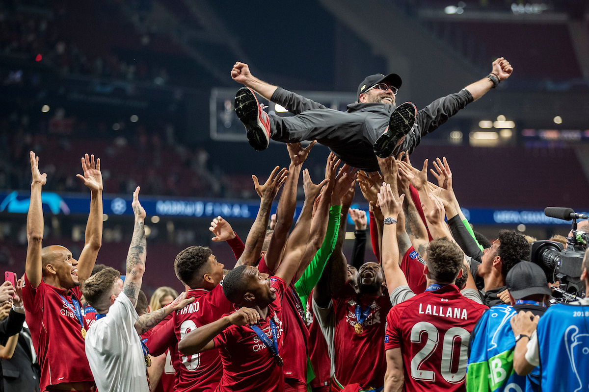MADRID, SPAIN - SATURDAY, JUNE 1, 2019: Liverpool's players throw Liverpool Manager Jurgen Klopp in the air as they celebrate a 2-0 victory in the UEFA Champions League Final match between Tottenham Hotspur FC and Liverpool FC at the Estadio Metropolitano. (Pic by Paul Greenwood/Propaganda)