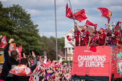 Liverpool’s James Milner, captain Jordan Henderson, Alex Oxlaide Chamberlain, Daniel Sturridge, Alberto Moreno and Trent Alexander-Arnold during an open-top bus parade through the city after winning the UEFA Champions League Final