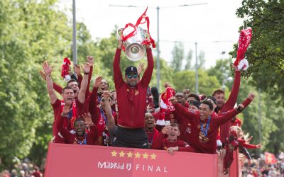 Liverpool’s manager Jürgen Klopp lifts the trophy during an open-top bus parade through the city after winning the UEFA Champions League Final. Liverpool beat Tottenham Hotspur. 2-0 in Madrid. To claim their sixth European Cup.