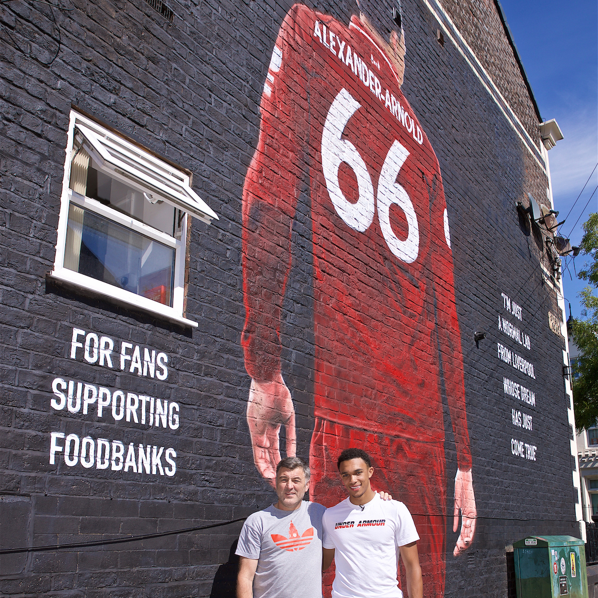 LIVERPOOL, ENGLAND - Thursday, August 8, 2019: Trent Alexander-Arnold poses for a photograph with Liverpool Foodbanks at the official opening of a mural of Liverpool's Trent Alexander-Arnold on the side of a building in Sybil Road, Anfield. The mural was commissioned by The Anfield Wrap and painted by local artist Akse P19. (Pic by David Rawcliffe/Propaganda)