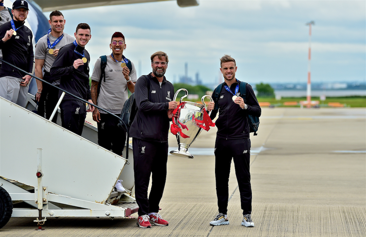 LIVERPOOL, ENGLAND - Sunday, June 2, 2019: Liverpool's manager Jürgen Klopp and captain Jordan Henderson arrive home at Liverpool John Lennon Airport with the trophy after winning the UEFA Champions League Final beating Tottenham Hotspur 2-0 to win their sixth European Cup. (Pic by David Rawcliffe/Propaganda)