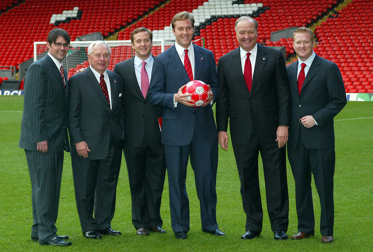 Liverpool, England - Tuesday, February 6th, 2007: George Gillett (2nd Left) with his sons Foster (L) and xxxx (R) and co-owner Tom Hicks (2nd from right) with his sons Tom Jnr (L) and Alex (R), on the pitch at Anfield after announcing their take-over of Liverpool Football Club in a deal worth around £470 million. Texan billionaire Hicks, who owns the Dallas Stars ice hockey team and the Texas Rangers baseball team, has teamed up with Montreal Canadiens owner Gillett to put together a joint £450m package to buy out shareholders, service the club's existing debt and provide funding for the planned new stadium in Stanley Park. (Pic by Dave Kendall/Propaganda)