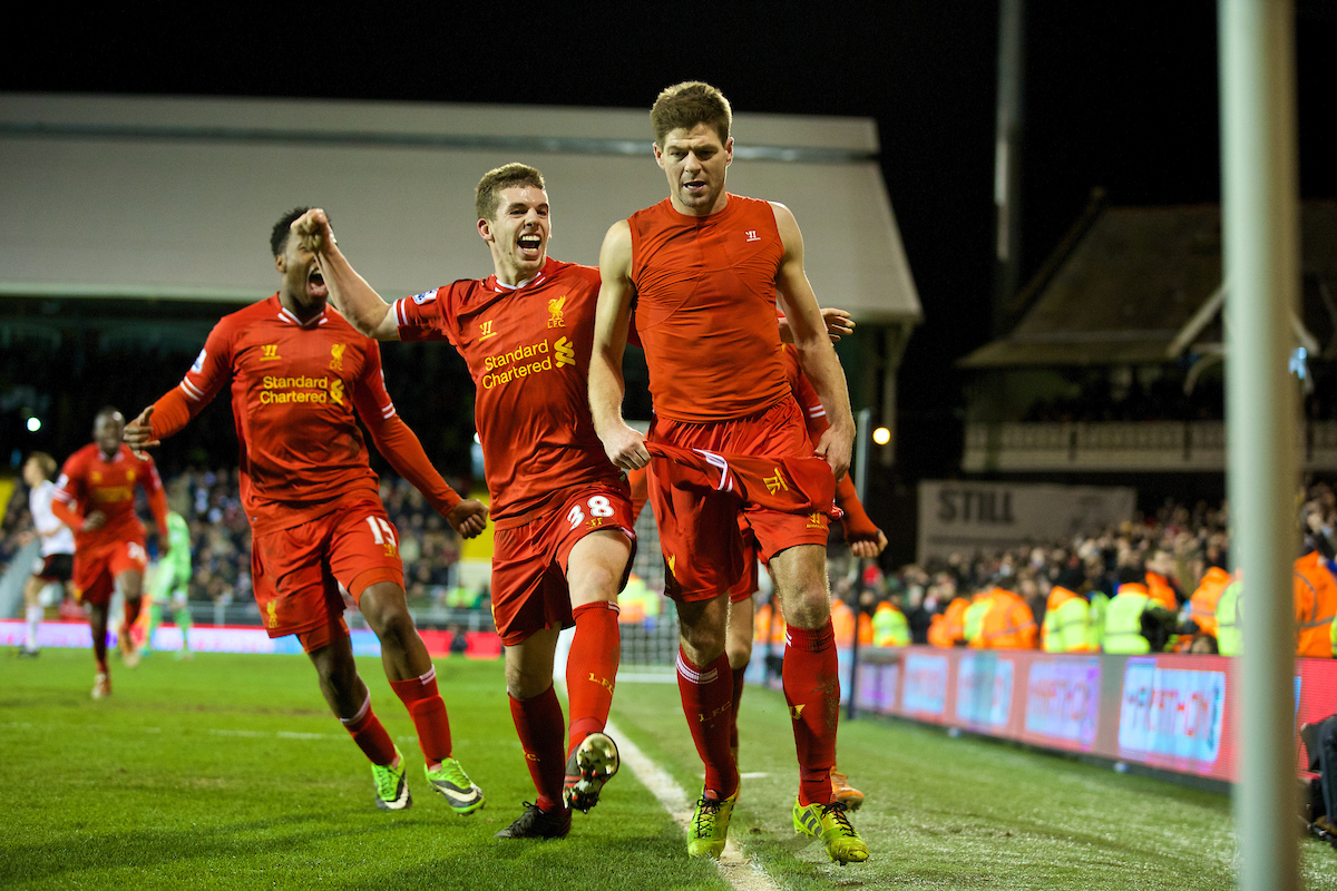 LONDON, ENGLAND - Wednesday, February 12, 2014: Liverpool's captain Steven Gerrard celebrates scoring the winning third goal against Fulham from the penalty spot with team-mates Jon Flanagan and Daniel Sturridge during the Premiership match at Craven Cottage. (Pic by David Rawcliffe/Propaganda)