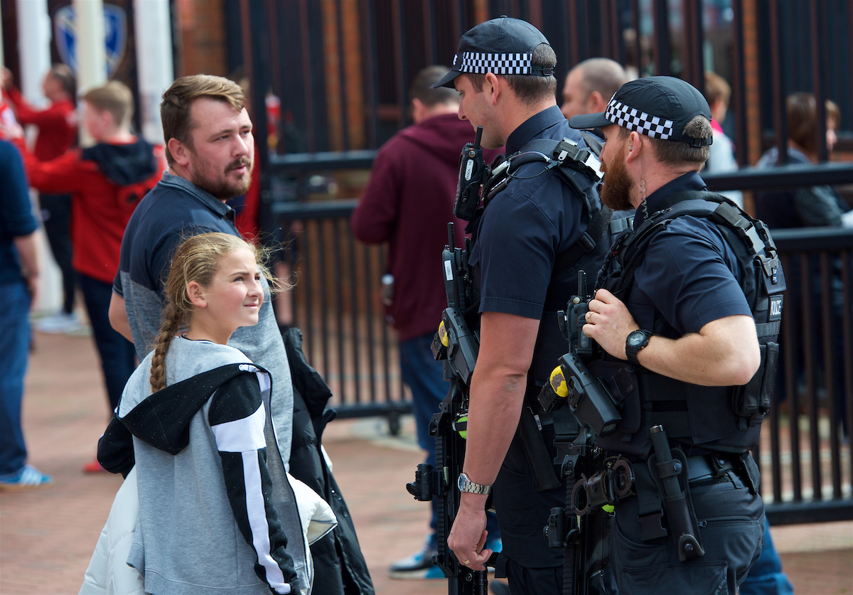 LIVERPOOL, ENGLAND - Saturday, September 16, 2017: Armed Merseyside Police officers patrol outside Anfield's Spion Kop stand before the FA Premier League match between Liverpool and Burnley at Anfield. (Pic by Peter Powell/Propaganda)