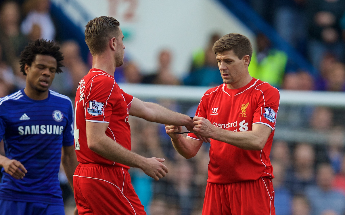 LONDON, ENGLAND - Sunday, May 10, 2015: Liverpool's captain Steven Gerrard hands the captain's armband on to Jordan Henderson during the Premier League match against Chelsea at Stamford Bridge. (Pic by David Rawcliffe/Propaganda)
