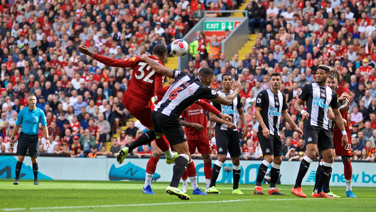 LIVERPOOL, ENGLAND - Saturday, September 14, 2019: Liverpool's Joel Matip is pulled back by Newcastle United's captain Jamaal Lascelles put no penalty is awarded during the FA Premier League match between Liverpool FC and Newcastle United FC at Anfield. (Pic by David Rawcliffe/Propaganda)