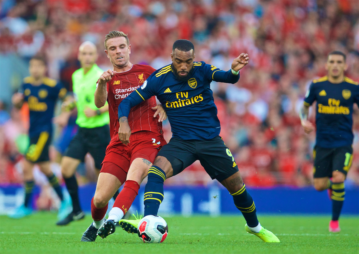 LIVERPOOL, ENGLAND - Saturday, August 24, 2019: Liverpool's captain Jordan Henderson (L) tackles Arsenal's Alexandre Lacazette during the FA Premier League match between Liverpool FC and Arsenal FC at Anfield. (Pic by David Rawcliffe/Propaganda)