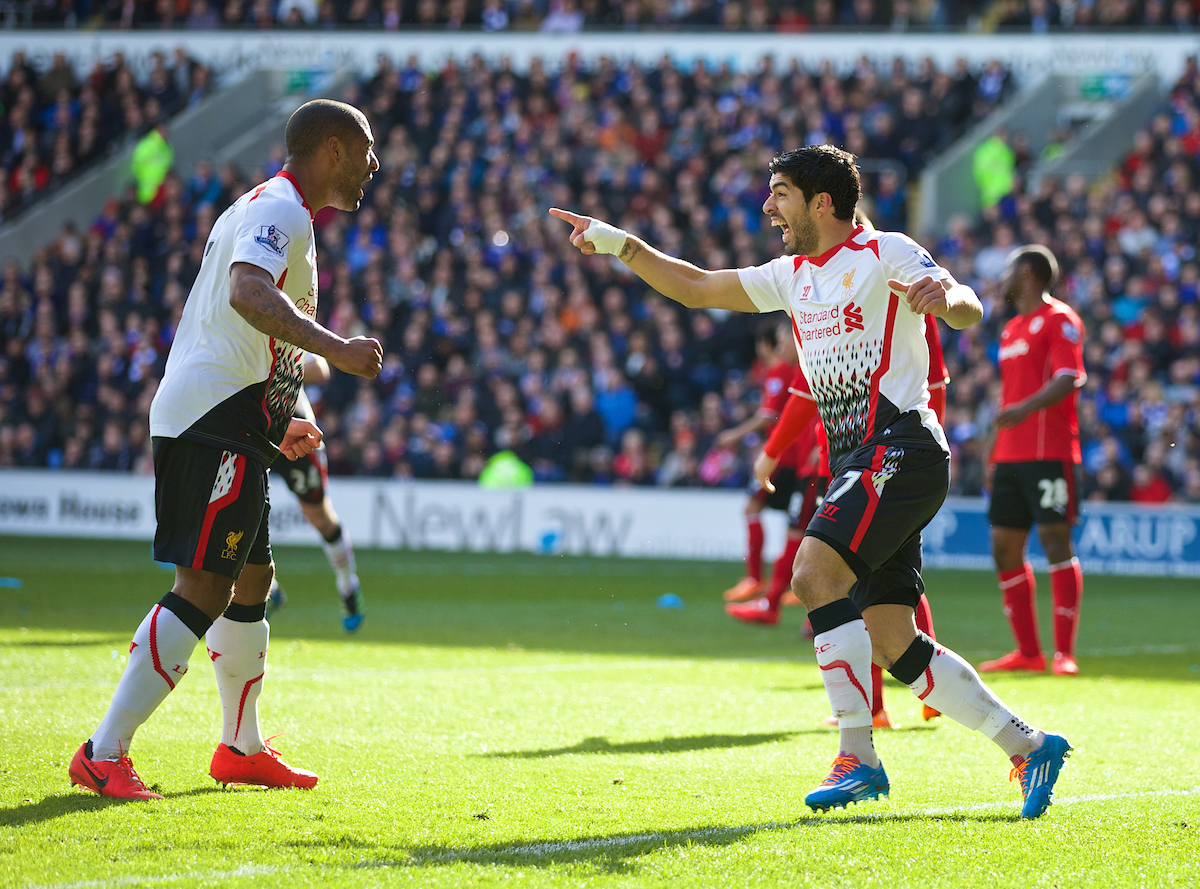 CARDIFF, WALES - Saturday, March 22, 2014: Liverpool's Luis Suarez celebrates scoring the first goal against Cardiff City, the first of his hat-trick, with team-mate Glen Johnson during the Premiership match at the Cardiff City Stadium. (Pic by David Rawcliffe/Propaganda)