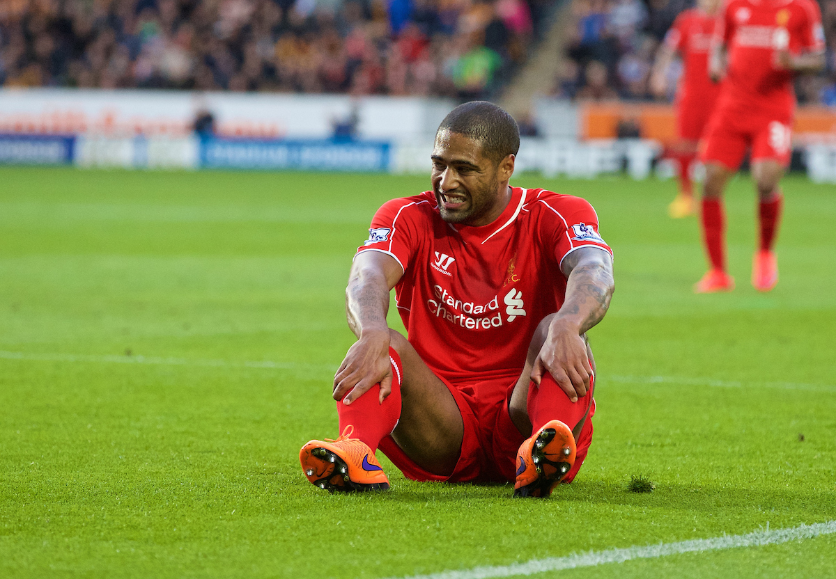 KINGSTON-UPON-HULL, ENGLAND - Tuesday, April 28, 2015: Liverpool's Glen Johnson feels the pain against Hull City during the Premier League match at the KC Stadium. (Pic by Gareth Jones/Propaganda)