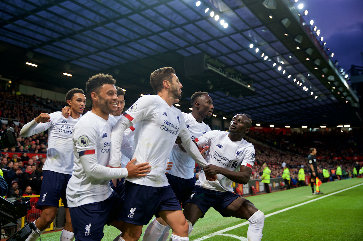 MANCHESTER, ENGLAND - Saturday, October 19, 2019: Liverpool's Adam Lallana (C) celebrates with team-mates after scoring the an equalising goal to level the score at 1-1 and help his side to continue their unbeaten start to the season during the FA Premier League match between Manchester United FC and Liverpool FC at Old Trafford. The game ended in a 1-1 draw. (Pic by David Rawcliffe/Propaganda)