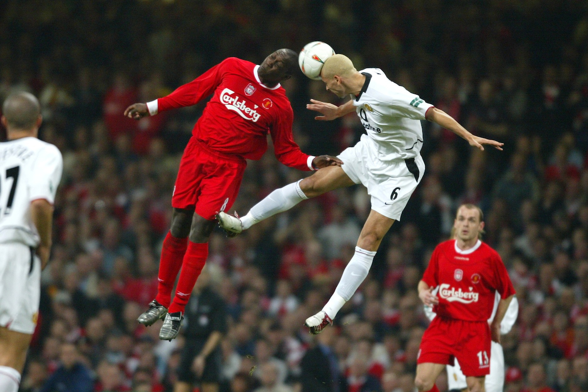 CARDIFF, WALES - Sunday, March 2, 2003: Liverpool's Emile Heskey and Manchester United's Wes Brown during the Football League Cup Final at the Millennium Stadium. (Pic by David Rawcliffe/Propaganda)