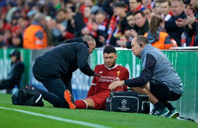 Alex Oxlade-Chamberlain is carried off injured during the UEFA Champions League Semi-Final 1st Leg match between Liverpool FC and AS Roma at Anfield
