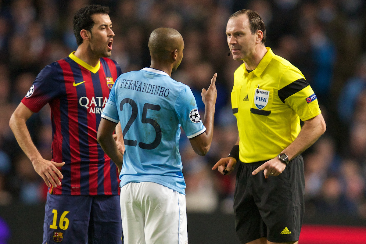 MANCHESTER, ENGLAND - Tuesday, February 18, 2014: Manchester City's Fernando Luiz Roza 'Fernandinho' is spoken to by referee Jonas Eriksson during the UEFA Champions League Round of 16 match against FC Barcelona at the City of Manchester Stadium. (Pic by David Rawcliffe/Propaganda)