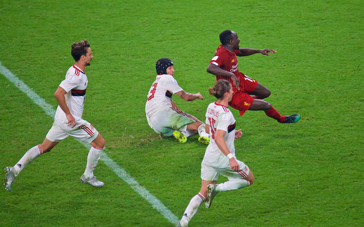 DOHA, QATAR - Saturday, December 21, 2019: Liverpool's Sadio Mané fouled by CR Flamengo's Rafael Alcântara do Nascimento 'Rafinha' but the penalty was disallowed after a VAR review during the FIFA Club World Cup Qatar 2019 Final match between CR Flamengo and Liverpool FC at the Khalifa Stadium. (Pic by Peter Powell/Propaganda)