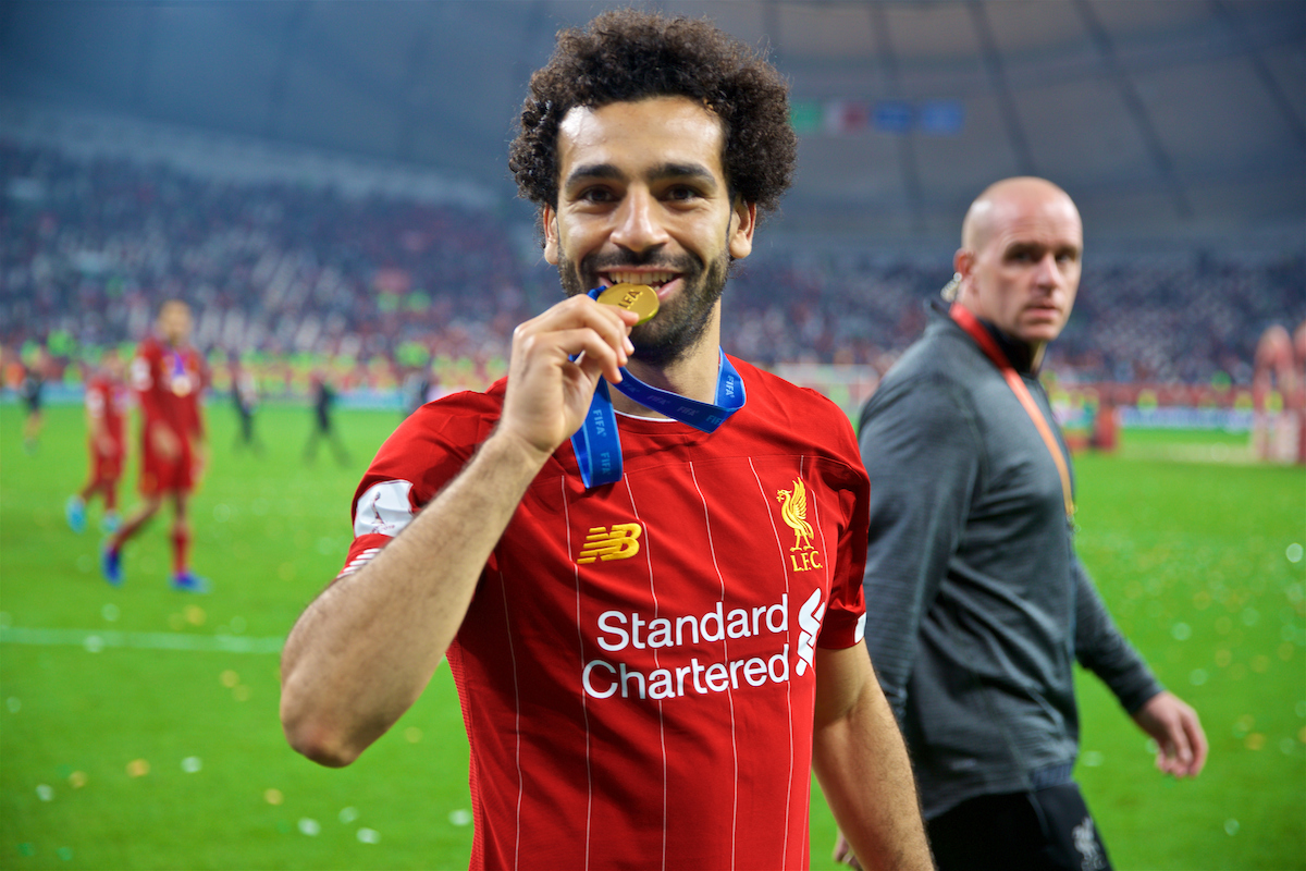 DOHA, QATAR - Saturday, December 21, 2019: Liverpool's Mohamed Salah bites his winners' medal after the FIFA Club World Cup Qatar 2019 Final match between CR Flamengo and Liverpool FC at the Khalifa Stadium. Liverpool won 1-0 after extra time. (Pic by David Rawcliffe/Propaganda)
