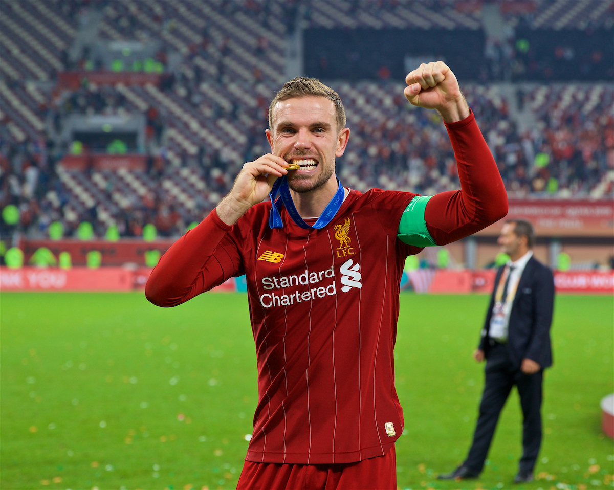 DOHA, QATAR - Saturday, December 21, 2019: Liverpool's captain Jordan Henderson bites his winners' medal after the FIFA Club World Cup Qatar 2019 Final match between CR Flamengo and Liverpool FC at the Khalifa Stadium. Liverpool won 1-0 after extra time. (Pic by David Rawcliffe/Propaganda)