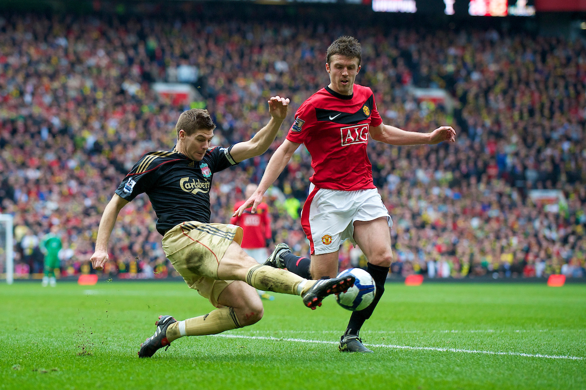 MANCHESTER, ENGLAND - Sunday, March 21, 2010: Liverpool's captain Steven Gerrard MBE and Manchester United's Michael Carrick during the Premiership match at Old Trafford. (Photo by: David Rawcliffe/Propaganda)