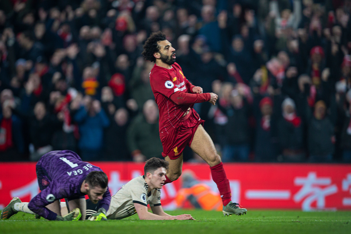 LIVERPOOL, ENGLAND - Sunday, January 19, 2020: Liverpool's Mohamed Salah takes off his shirt as he celebrate scoring the second goal during the FA Premier League match between Liverpool FC and Manchester United FC at Anfield. Liverpool won 2-0. (Pic by David Rawcliffe/Propaganda)