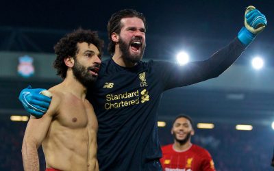 Liverpool's Mohamed Salah celebrates scoring the second goal with team-mate goalkeeper Alisson Becker during the FA Premier League match between Liverpool FC and Manchester United FC at Anfield