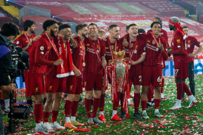 Liverpool’s Andy Robertson celebrates with the Premier League trophy as The Reds are crowned Champions