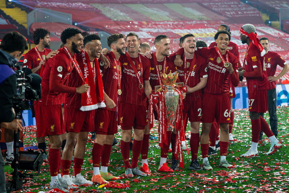 Liverpool’s Andy Robertson celebrates with the Premier League trophy as The Reds are crowned Champions