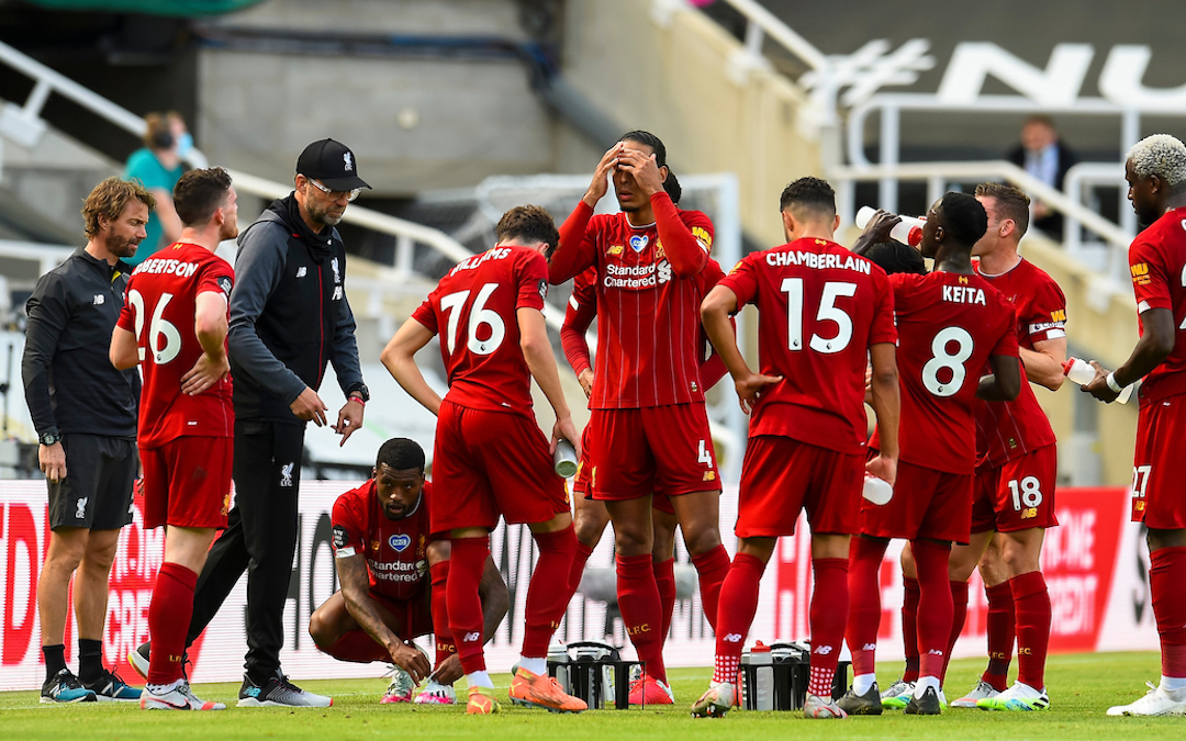 Liverpool’s manager Jürgen Klopp speaks to his players during a water break during the final match of the FA Premier League season between Newcastle United FC and Liverpool FC at St. James' Park