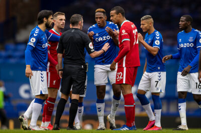 Everton's André Gomes, Yerry Mina, Richarlison de Andrade and Liverpool's captain Jordan Henderson and Joel Matip argue with referee Michael Oliver during the FA Premier League match between Everton FC and Liverpool FC, the 237th Merseyside Derby, at Goodison Park